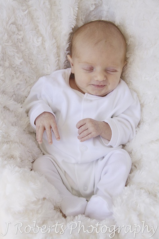 sleeping baby smiling - newborn baby portraits Sydney